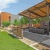 Outdoor lounge and recreation area at our apartments in Fort Worth, featuring a lawn, cornhole, and outdoor couches.