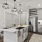 Alternate view of open-plan kitchen with kitchen island, large basin sink, wine storage, dishwasher and up-to-date appliances