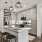 Kitchen with runner rug, modern light fixtures, wine storage, refrigerator with water dispenser, oven, microwave, and island